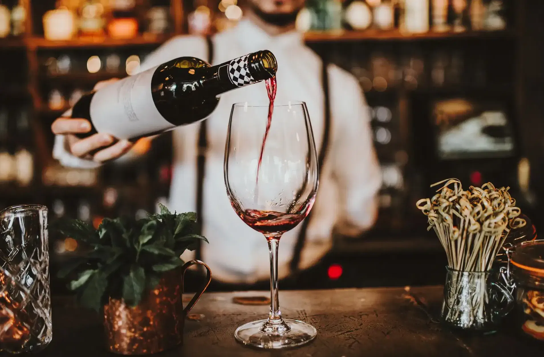 Bartender pouring vintage wine